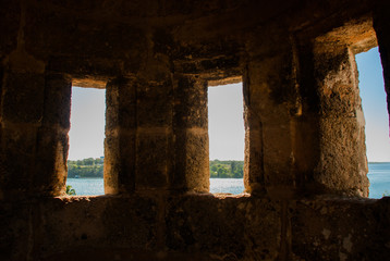 Huge stone walls with Windows. Old Fortress Fortaleza de Jagua. Castillo de Jaguar. Cuba, Cienfuegos.