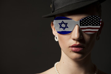 Portrait of woman with USA and Israel flag sunglasses
