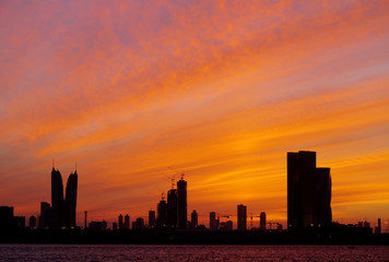 Bahrain skyline and dramatic sky during sunset