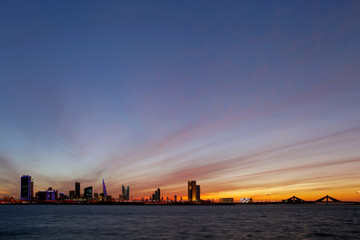 Fototapeta premium Bahrain skyline during evening hours at sunset