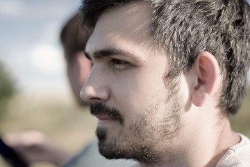 Obraz premium Close-up profile portrait of handsome with beard