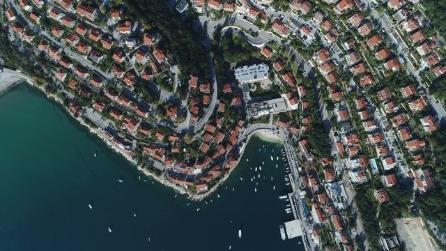 Overhead drone shot of beautiful holiday homes and residential apartment buildings in Rabac town in Croatia