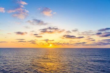 Sunset in the Atlantic Ocean. Beautiful sunset in the ocean view from the ship. View from the cruise ship. Atlantic Ocean.