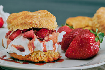 British scones filled with whipped cream, jam and strawberries