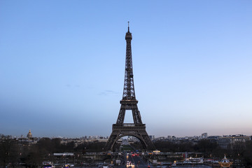 Eiffel Tower on Champs de Mars in Paris, France at the evening
