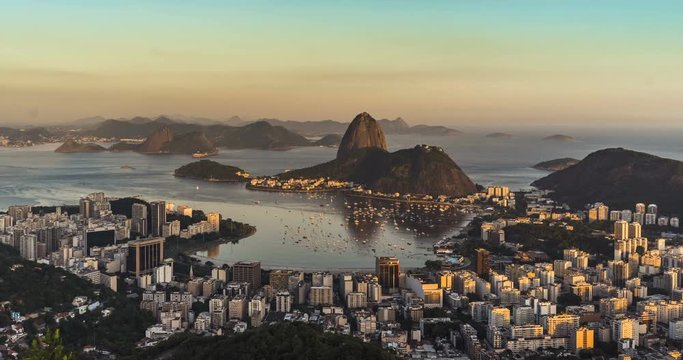 Sunset over Rio de Janeiro skyline with Sugarloaf Mountain, Brazil. Panning Time Lapse. Vintage colors