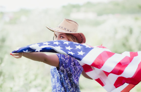 Young woman with american flag 4th of july