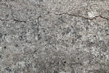 The texture of the old concrete slab with a crack. High contrast