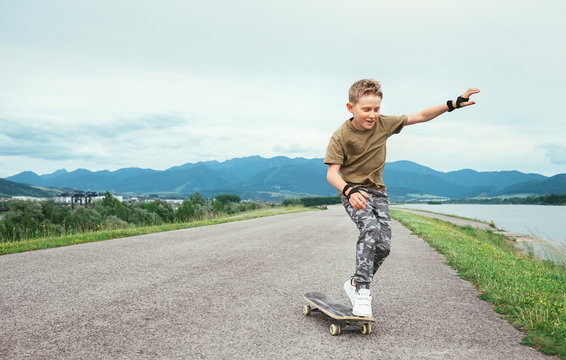 Boy learn to skate on skateboard