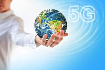 Earth from Space in hands, globe in hands. 5G k Internet mobile wireless concept. Elements of this image furnished by NASA. 3D illustration.