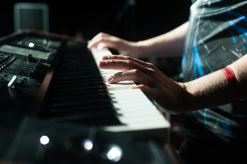 Hands on the music keyboard