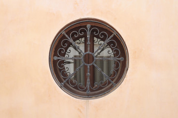 Fototapeta na wymiar Round window on a wall
