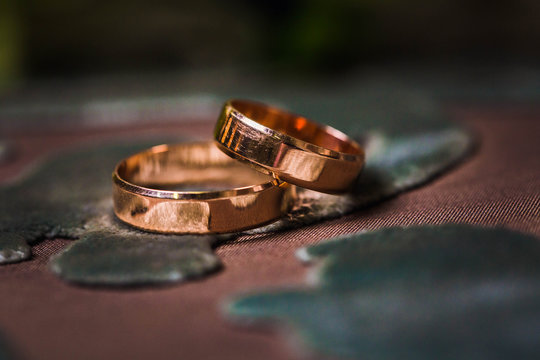 Couple wedding gold rings, closeup