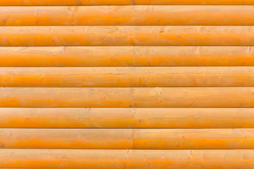 A wooden wall. Wall of logs.