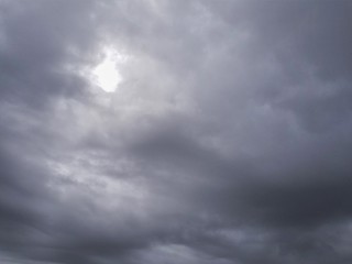 Obraz premium Bright Hole in Storm Clouds