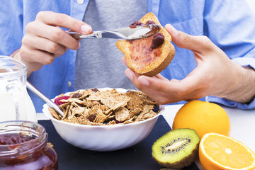 hands with jam toast and breakfast buffet, healthy diet