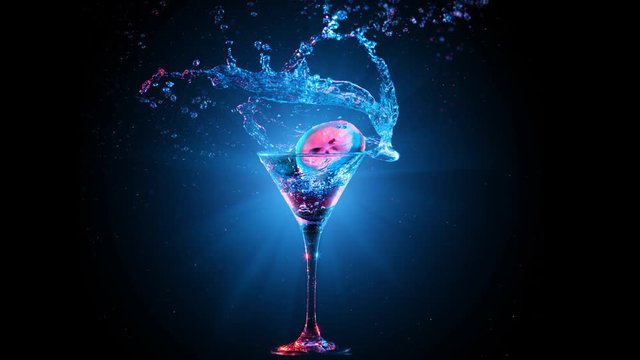 Bright modern cocktail with lemon falling in glass, splashing water on dark background. Blue and red color mixed light. Drops, bokeh and glare moves on the frame. Frozen in motion. Slow motion 4K