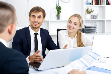 Fototapeta premium Business colleagues with document in hands