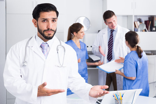 Male doctor meeting patient in medical office