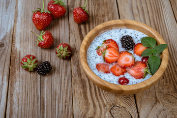 Healthy  superfood, chia pudding with berries, strawberry and mint