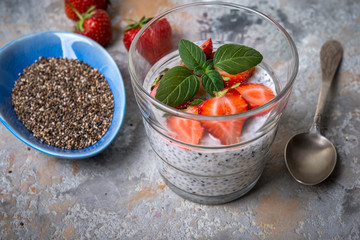 Healthy  superfood, chia pudding with berries, strawberry, mint, chia seeds