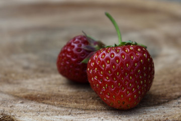 Strawberry fruit on the wooden