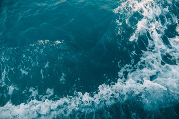 Dark turquoise waves of the Aegean Sea diverging from the yacht. Turkey, Bodrum.
