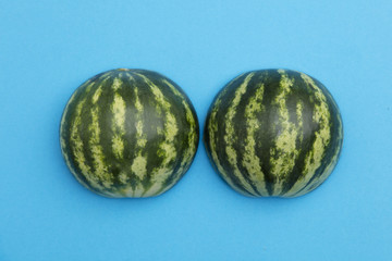 Fresh sliced watermelon on a bright blue background