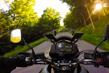 Driving Motorcycle on forest montait twisties road