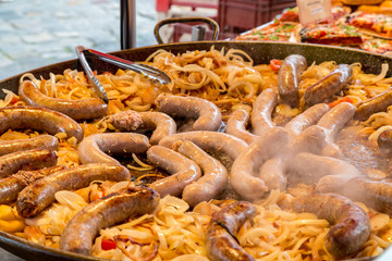 Sausages Steaming in a Giant Cauldron in a Public Outdoor Market