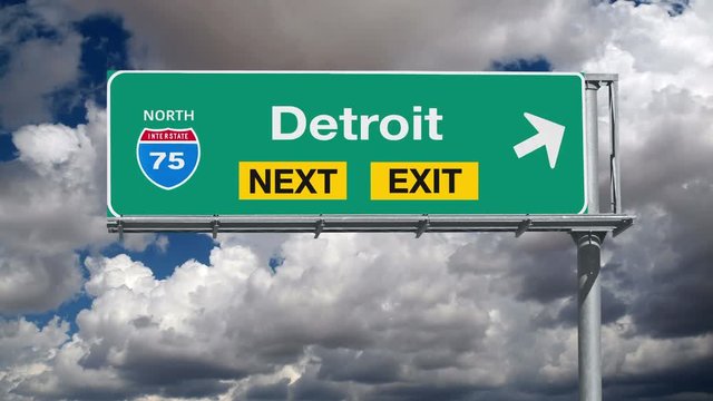 Detroit Michigan Freeway Exit Sign with Time Lapse Clouds
