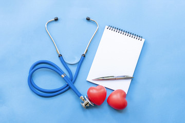 Cardiologist's day; doctor's day; heart disease; Cardiology, blue stethoscope with two red hearts,...