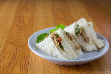 bread sandwich with tuna fish, slices on plate