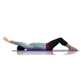 Mother woman exercising doing postnatal workout. Female fitness stretching hands and legs in gym...