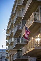 American flags on side of residental building