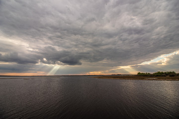 sun streaking through the clouds