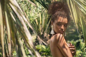 Tropical shoot of african american beauty.