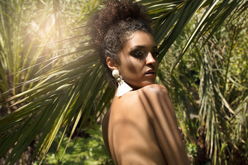 Tropical shoot of african american beauty.