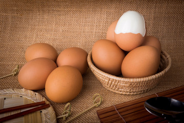 Set Eggs in a basket on  gunny (sackcloth)  background