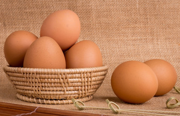 Set Eggs in a basket on  gunny (sackcloth)  background