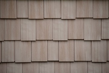 tan staggered shake siding construction exterior