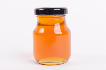 Honey bottle isolated on white background