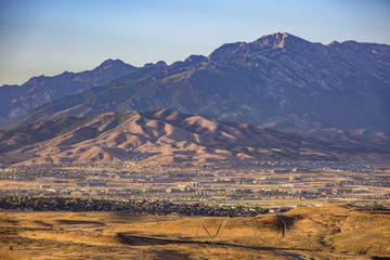Lone Peak and lower mountains at sunset