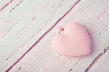 New Year's Christmas toy heart on a beautiful pink table