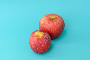 Red apple on blue background