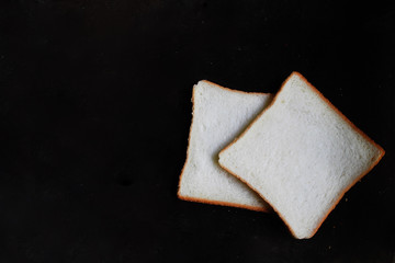 Sliced Wheat Bread on dark background