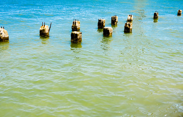 Obraz premium Cement pillars of an old abandoned bridge