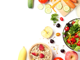 Top view of mixed vegetables salad, muesli and fresh fruits on white background. copy space