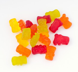 Macro picture of colorful gummy bears isolated on white background. 