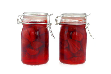   strawberry jam in transparent glass jar isolated on white background. Berry season. strawberry crop